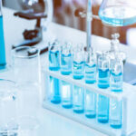 Laboratory test tubes and solution with stethoscope background. Science and Medical concept. Scientist research and analysis biotechnology concept