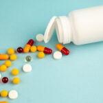 front-view-different-pills-with-plastic-flask-blue-background-lab-health-covid-hospital-science-pandemic-drug-color-virus